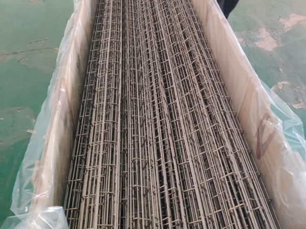 Welded cable tray in a cardboard box with plastic film over inner cloth